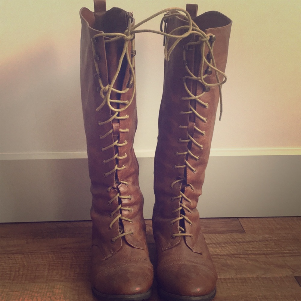 Knee high, faux leather, lace up boots.